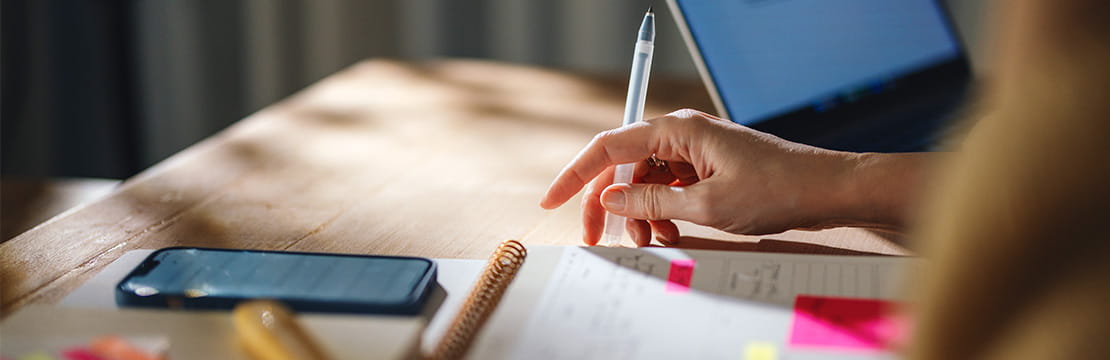 Small business owner using digital tools to explore AI-powered productivity solutions.